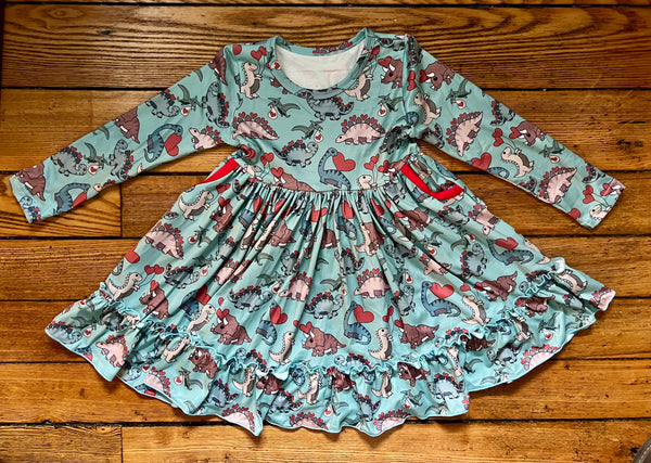 Detail of pocket on the Dinosaur Hearts dress with colorful dinosaur print